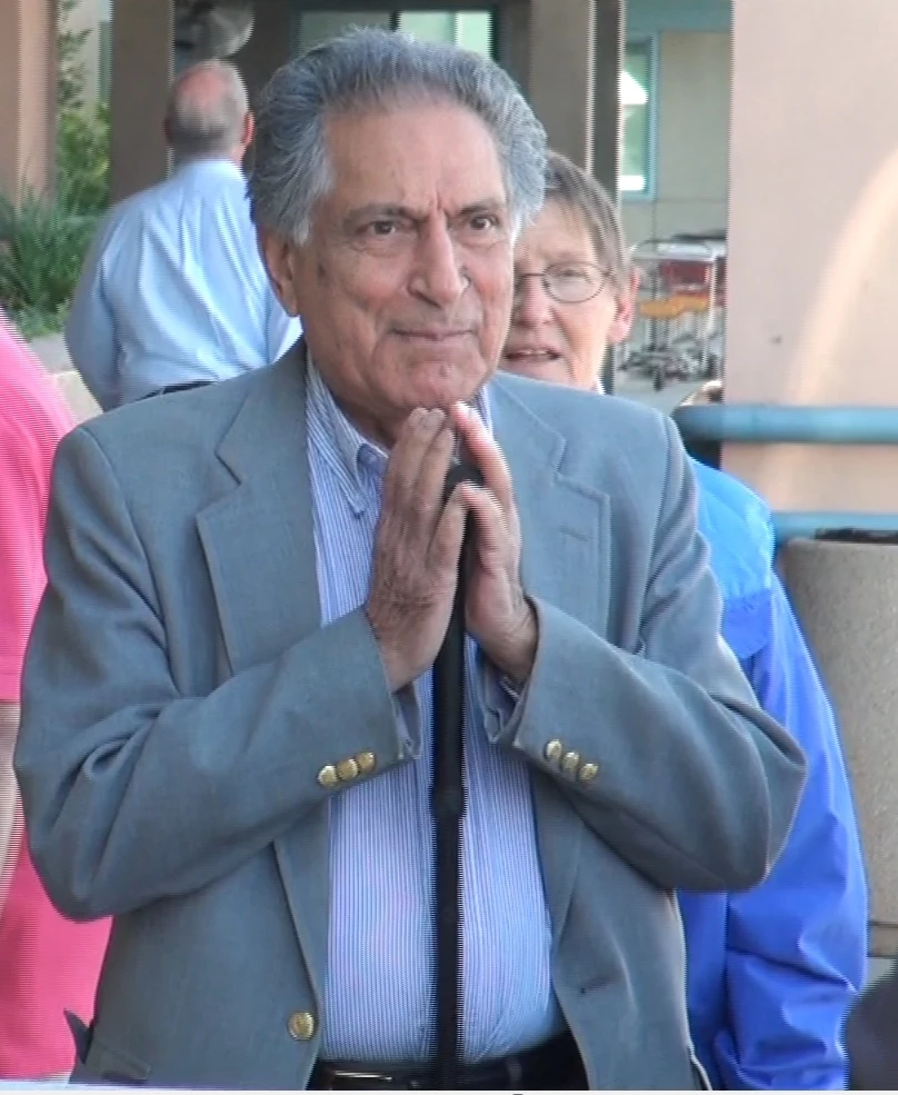Ishwar Puri greeting those present with his palms together